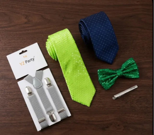Flat lay of YZ Party accessories including a neon green tie, navy tie, and grey suspenders.